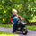 Kids Motorcycle with Training Wheels, 12V Ride-on Toy for Ages 3-8 Years Old at 3.7 Mph Top Speed, Battery-Operated Motorbike for Kids with Lights, Music, Black